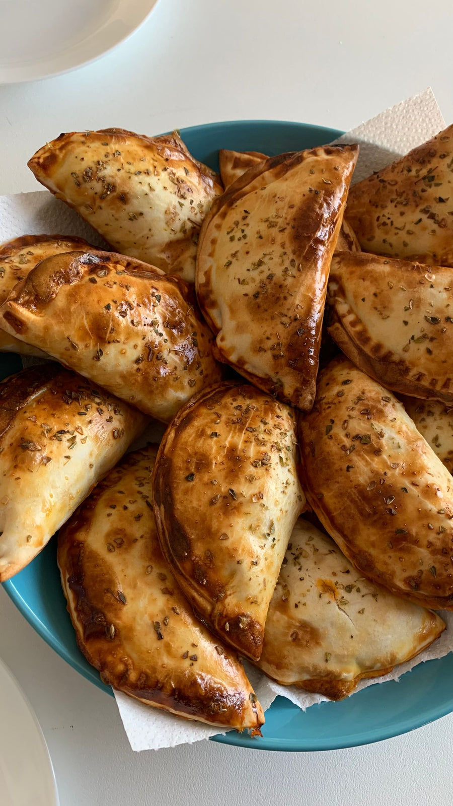 Golden baked empanadas on a plate